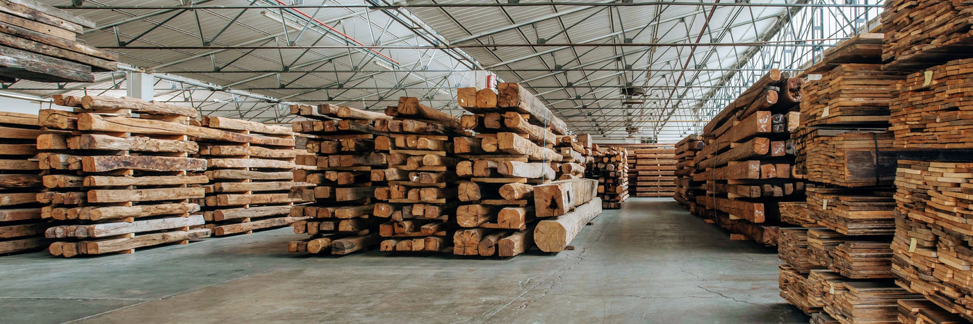 teak-wood-logs-piled-in-wood-warehouse-Object-Embassy